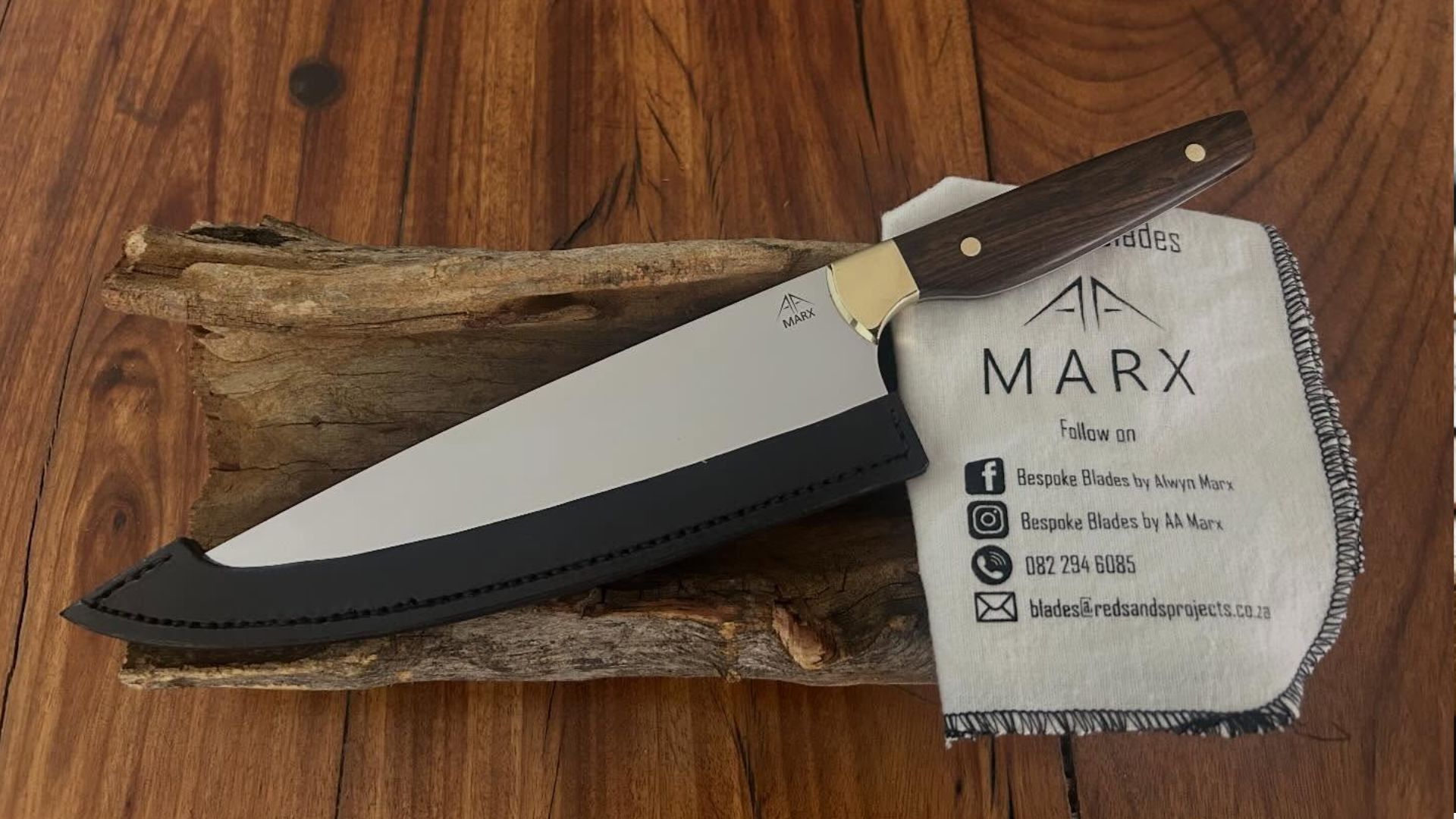 Handcrafted custom knife on a workshop table